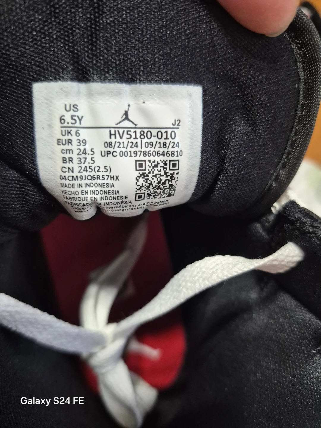 These are authentic Air Jordan 1 Mid sneakers in a black and red - photo 5