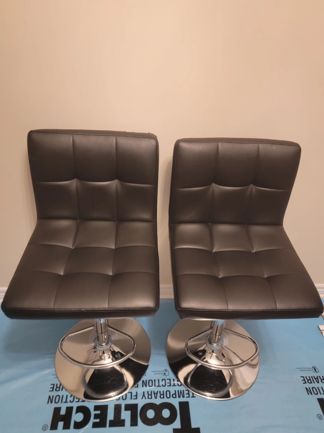 Two Black Adjustable Bar Stools