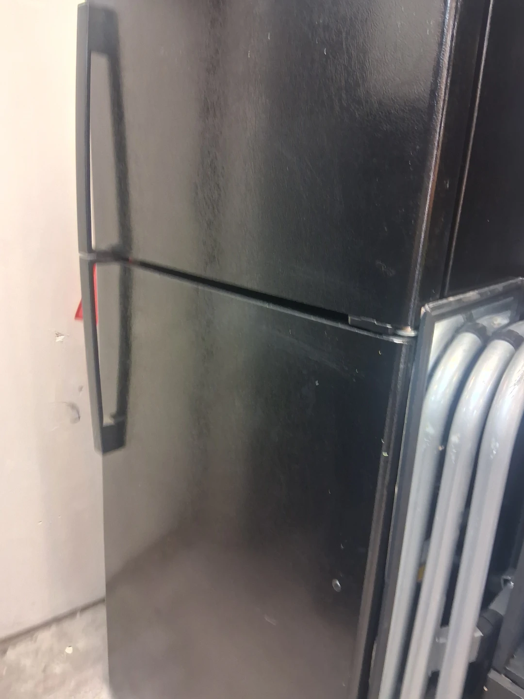 Black Whirlpool Top-Freezer Refrigerator