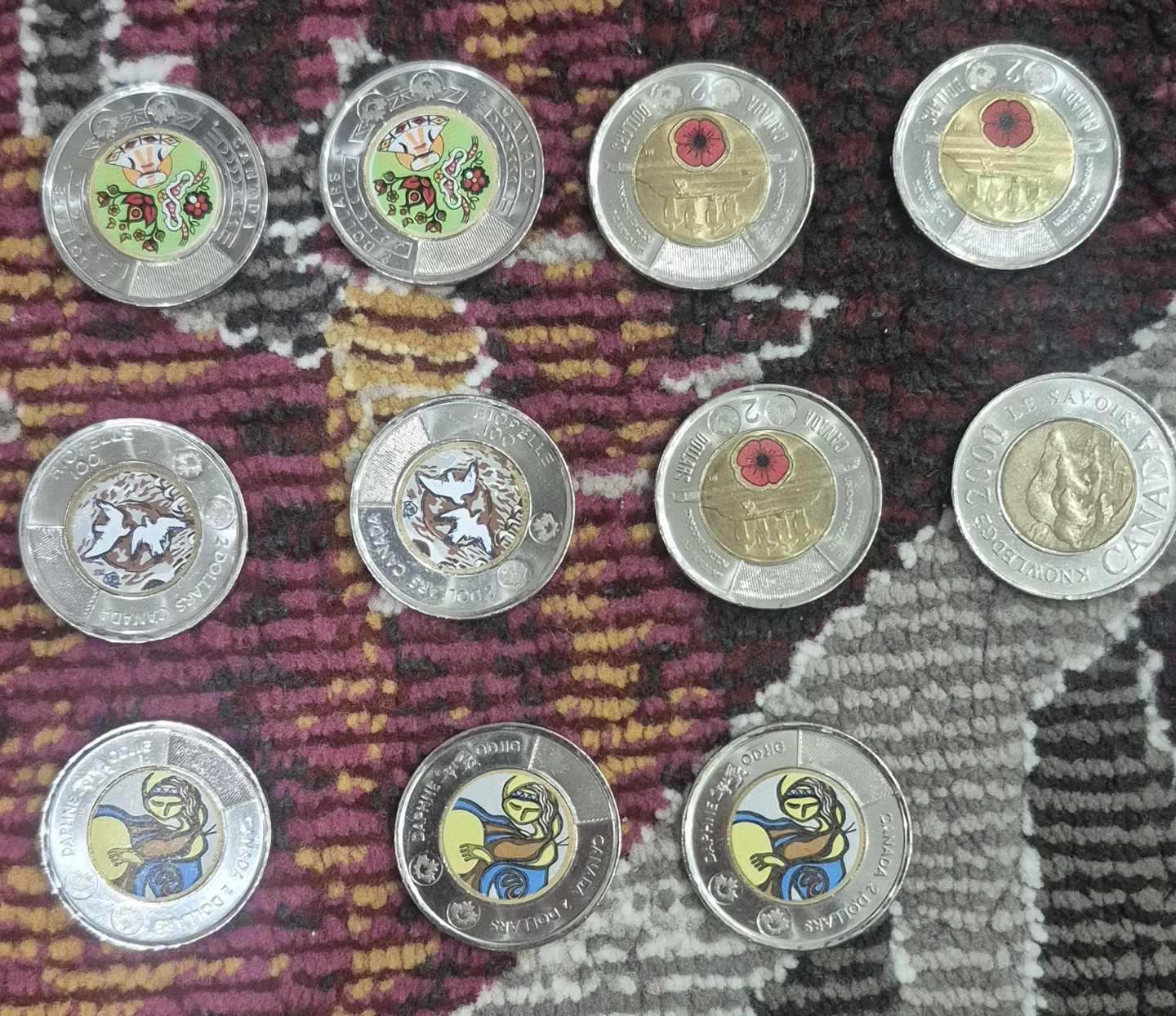 Collection of 11 Canadian Two-Dollar Coins