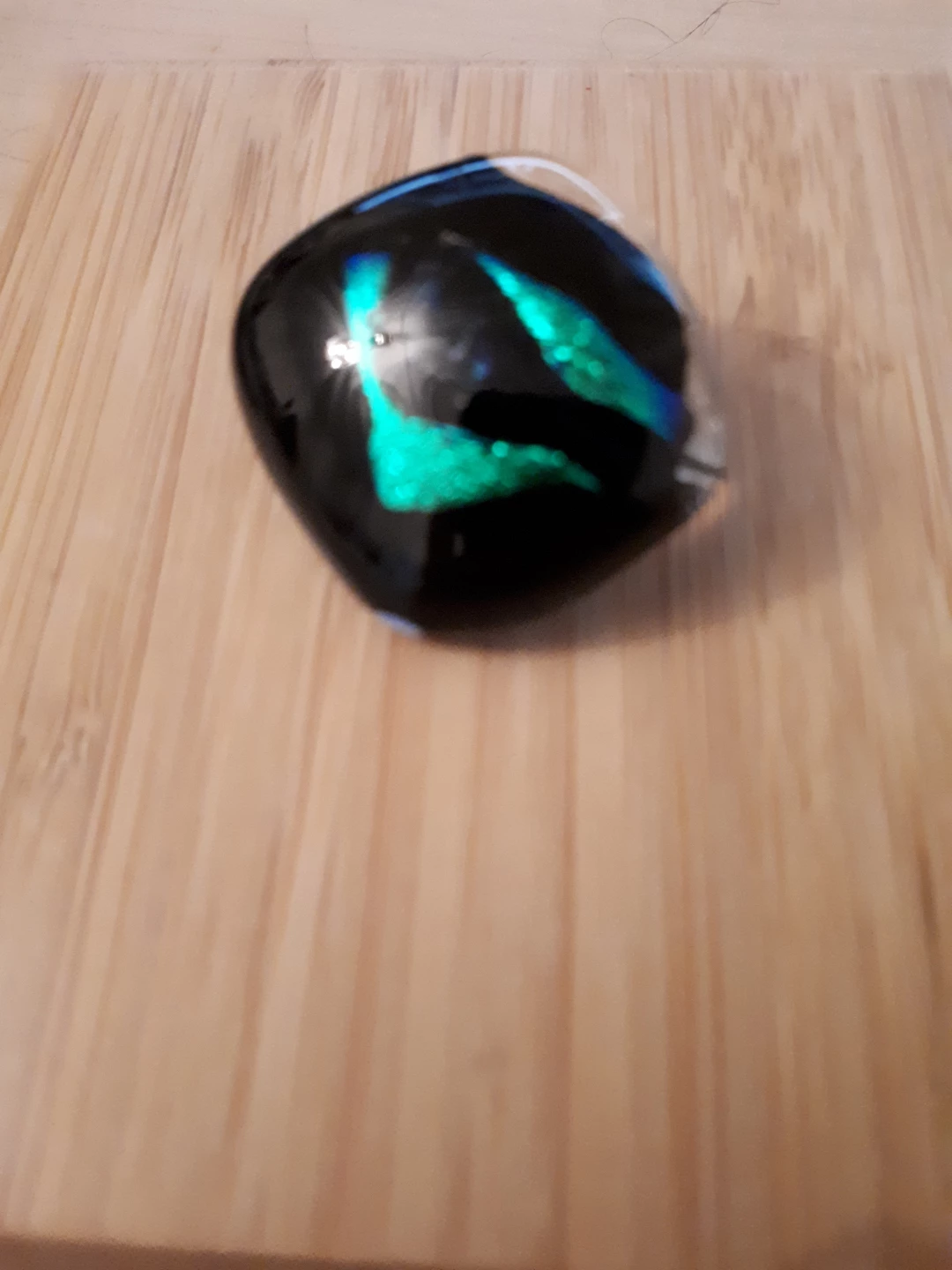 Black and green glass pin