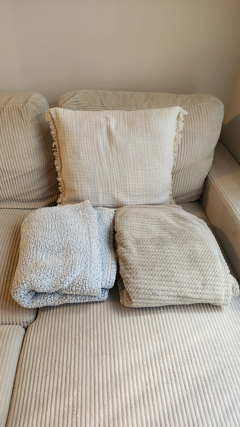 Cream Throw Pillow and Two Blankets