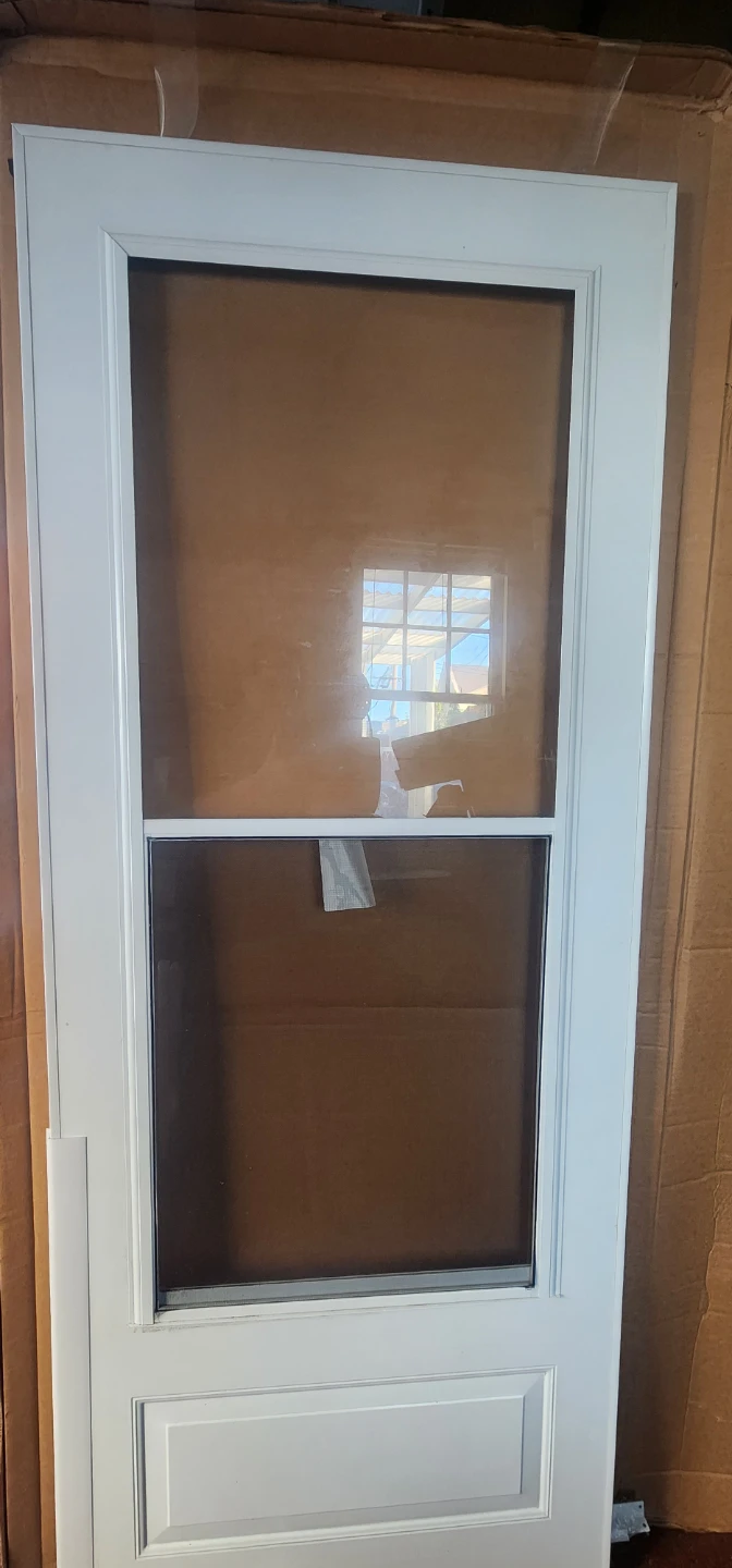 Storm Door 32"x80" NEW IN BOX, Self-storing glass