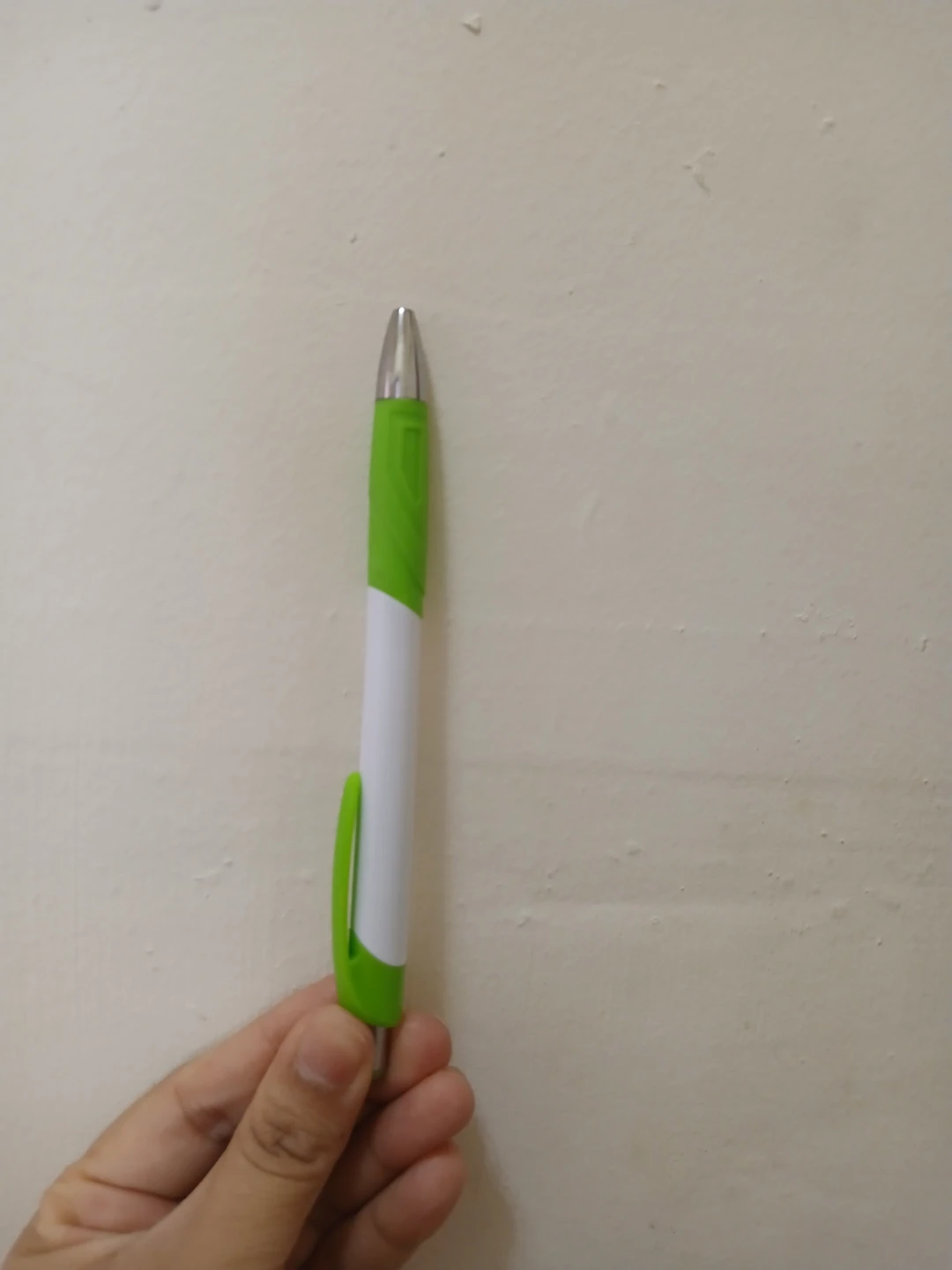 Green and White Ballpoint Pen