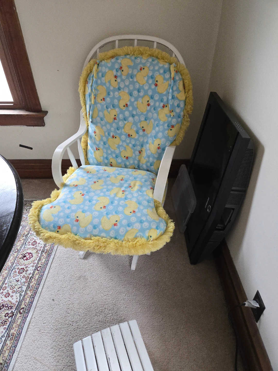 White Wooden Rocking Chair with Duck Print Cushion
