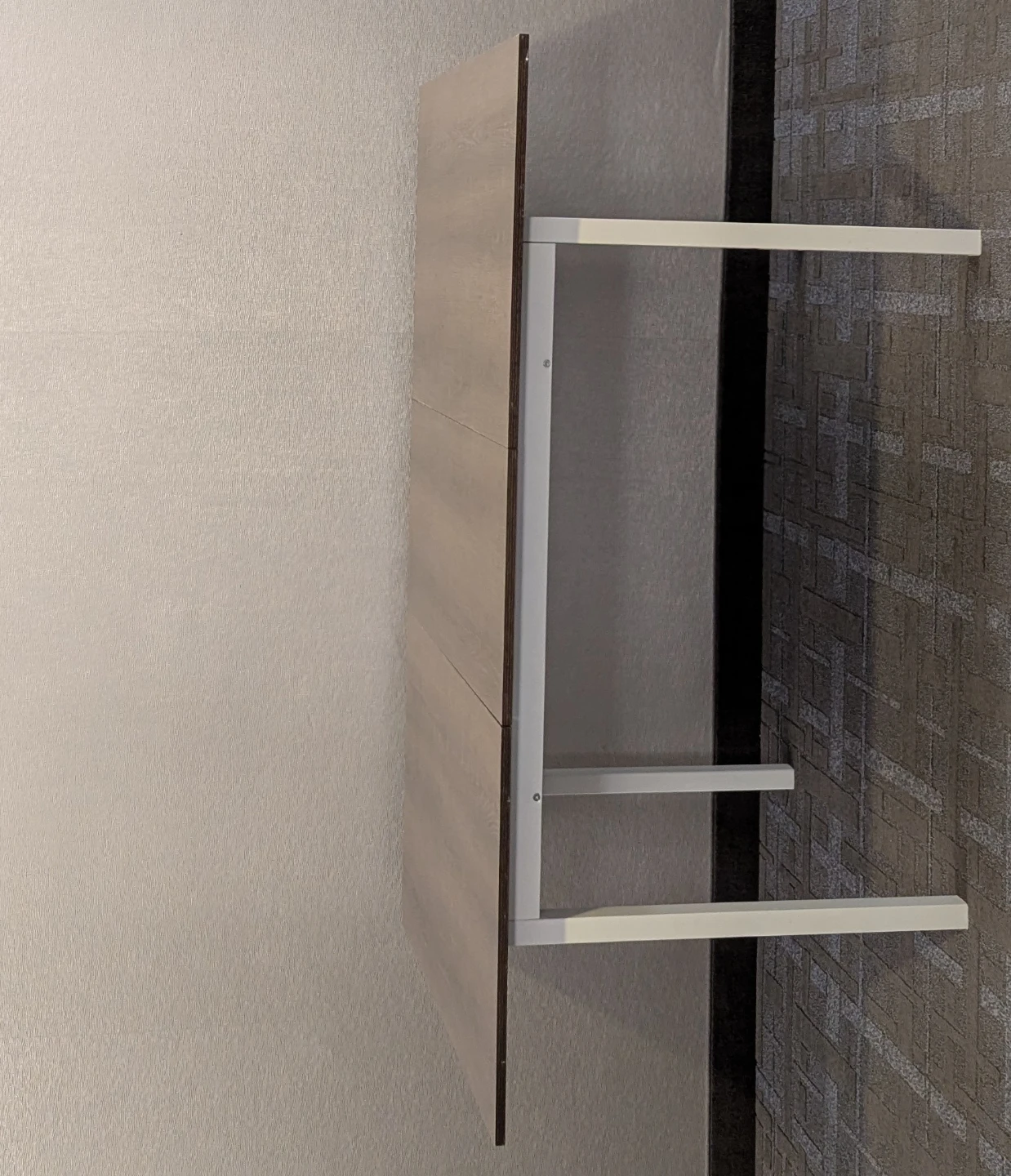 Wall-mounted wood grain fold-down table