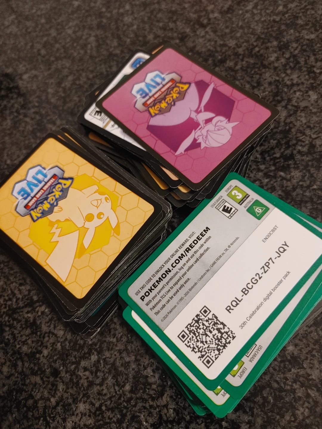 Large stack of Pokemon TCG Live code cards