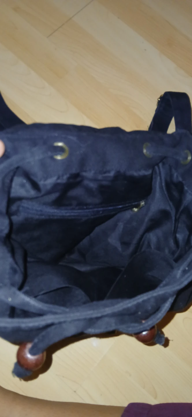 Embroidered black canvas backpack