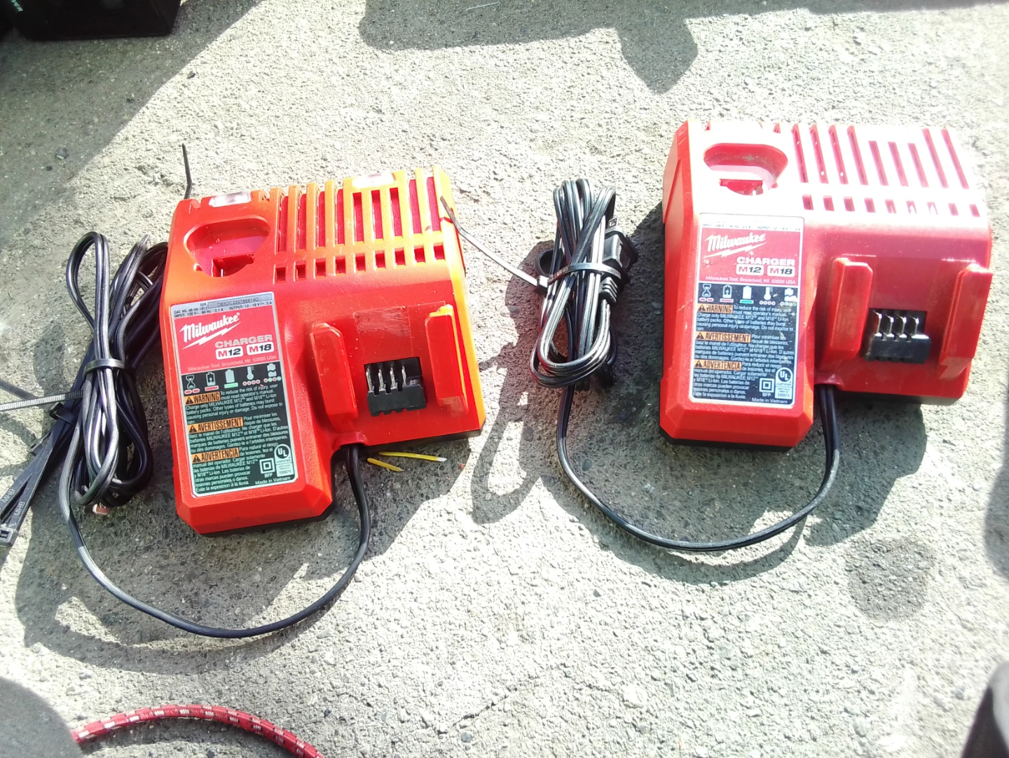 Two Milwaukee M12 and M18 Multi-Voltage Chargers