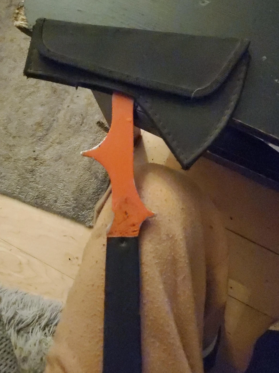 Orange camping hatchet with sheath