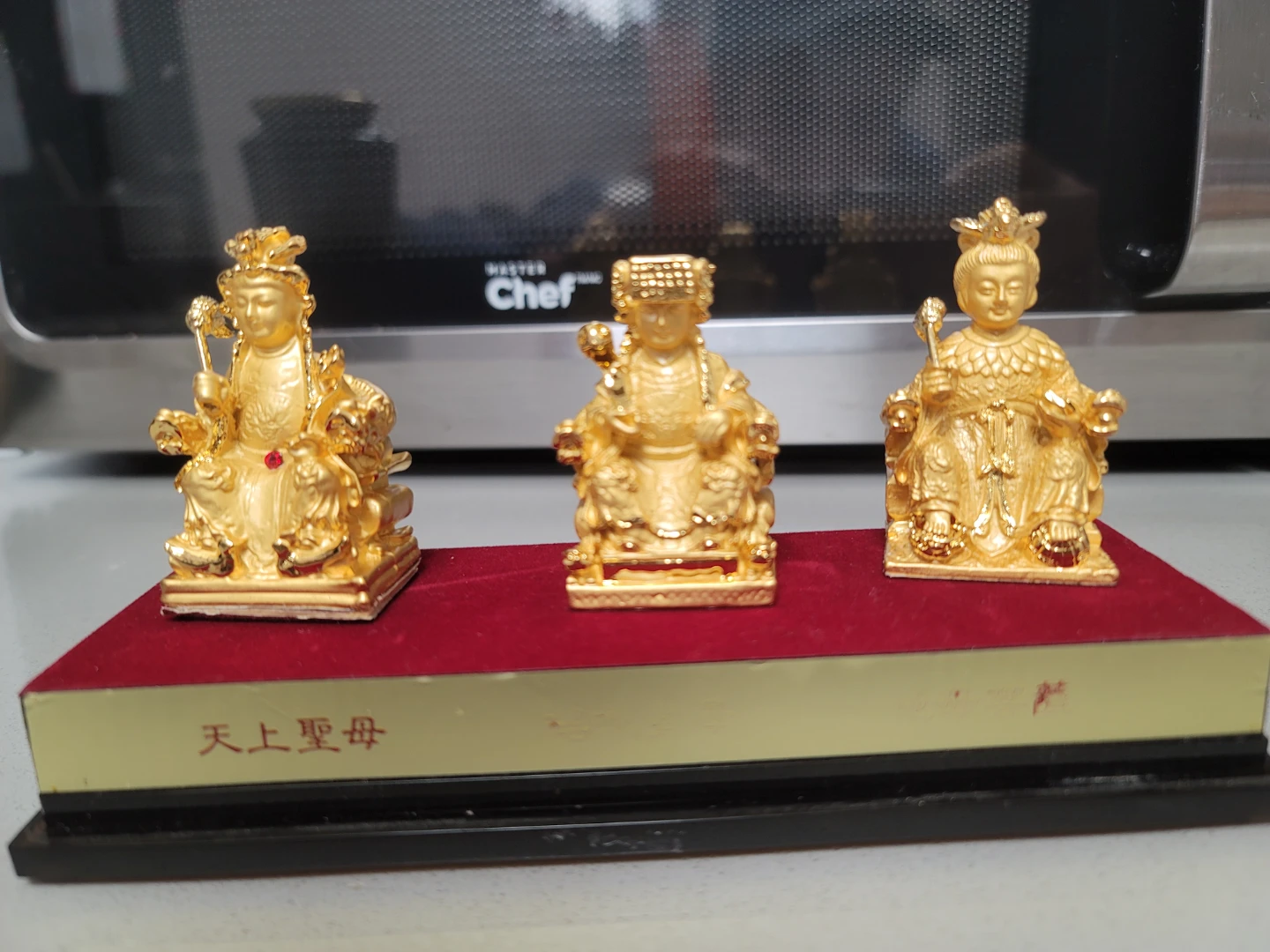 Gold-tone Mazu figurine set