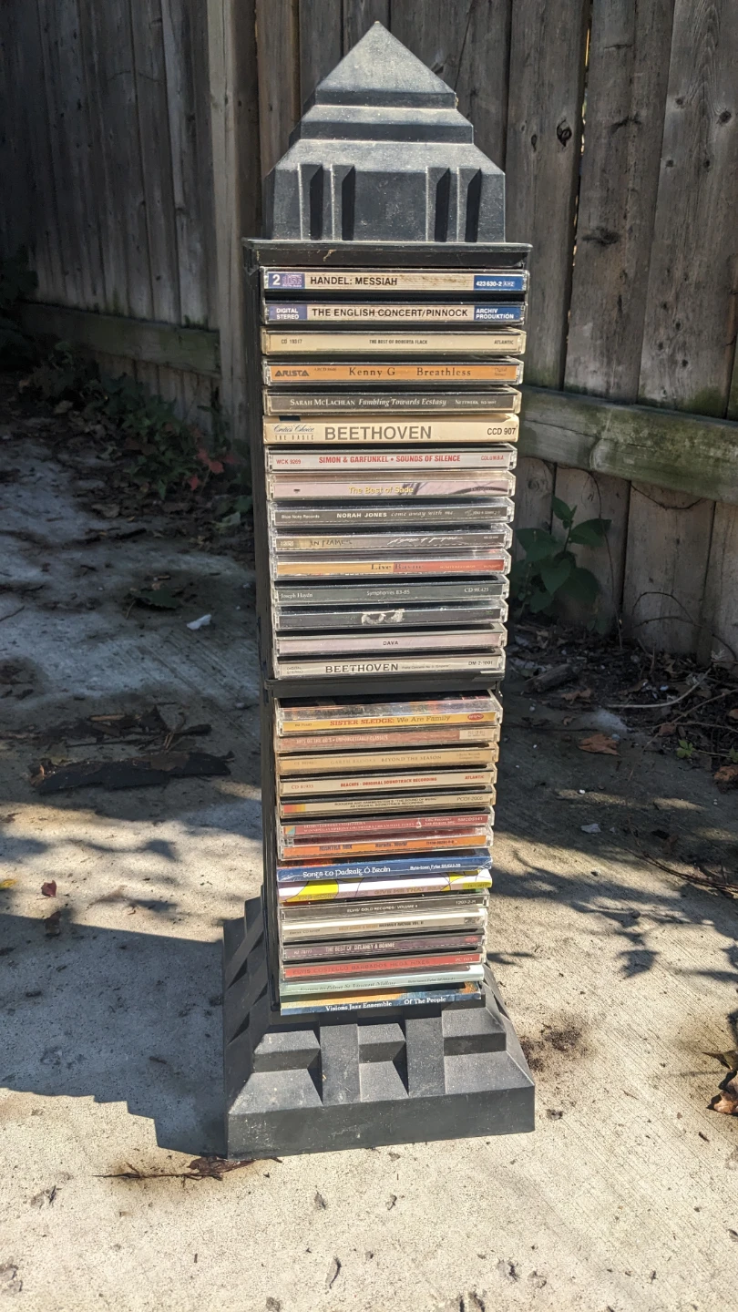 Tower CD storage rack with collection