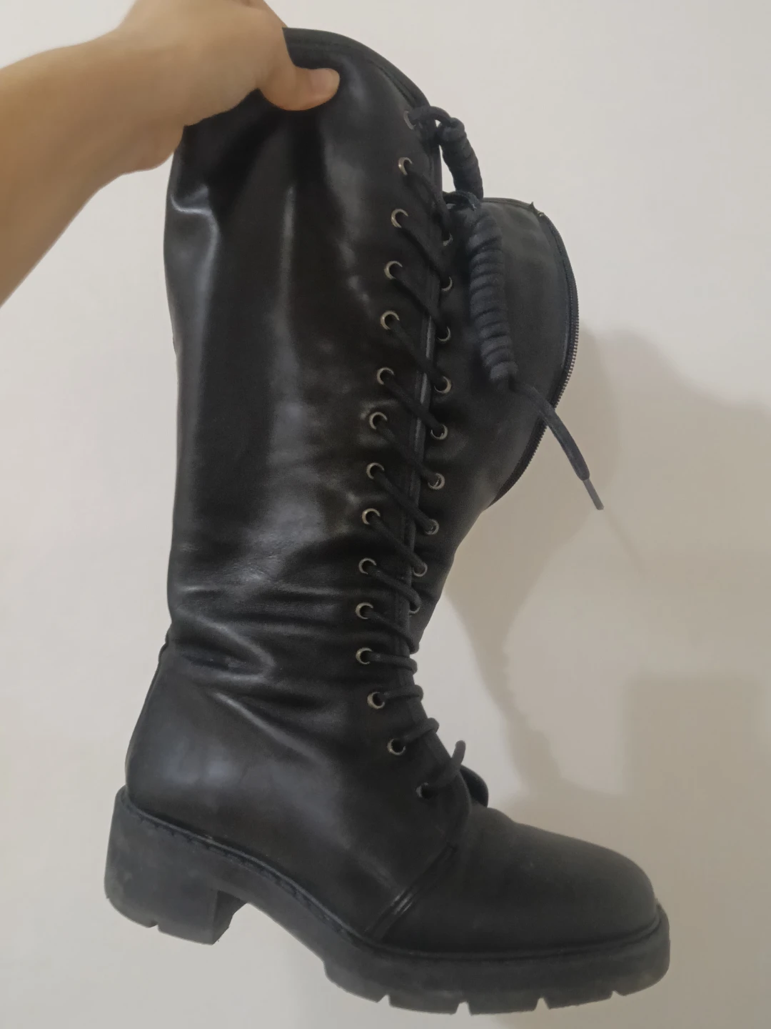 Black lace-up knee-high boots