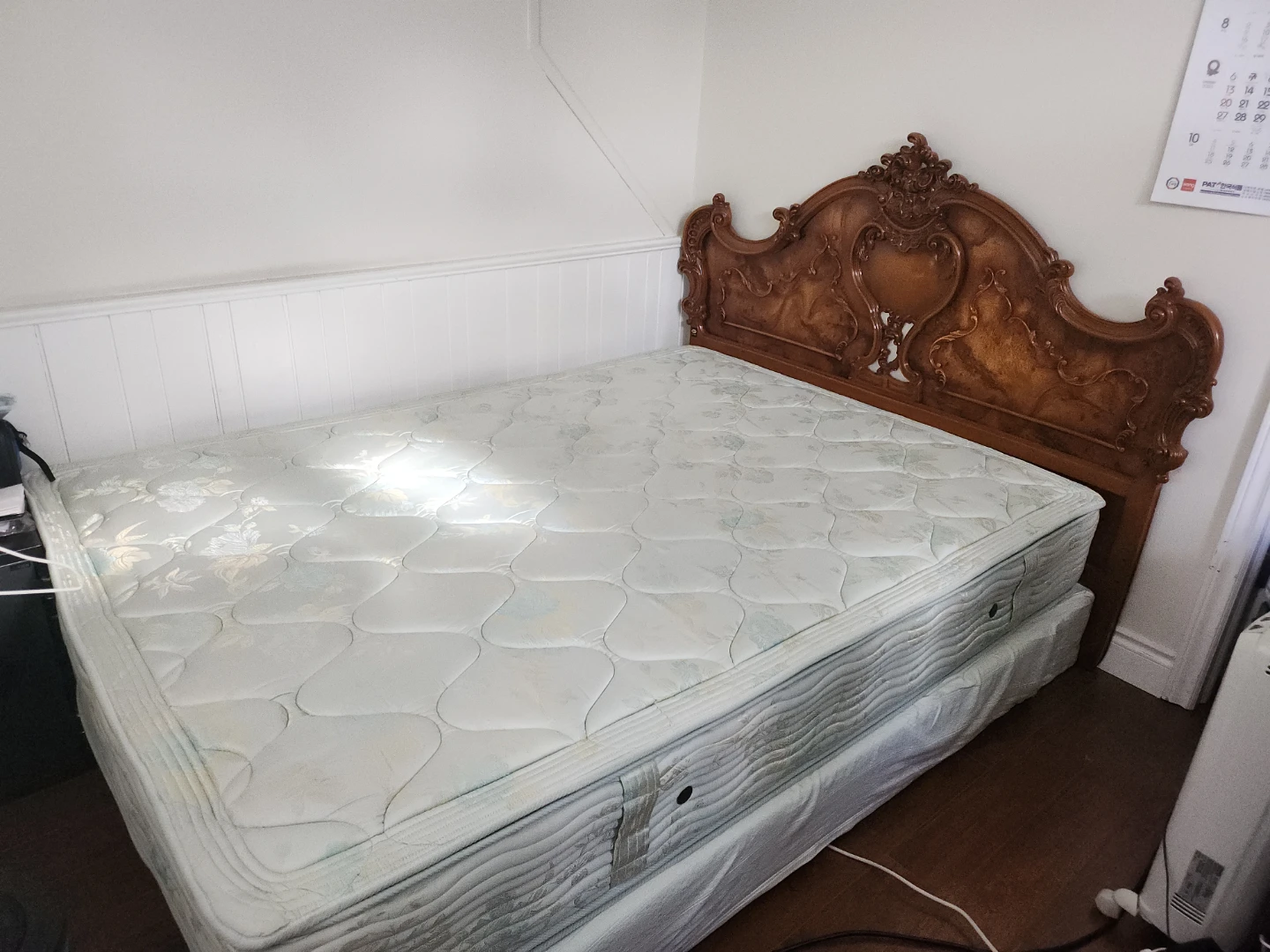 Bed with Ornate Wood Headboard
