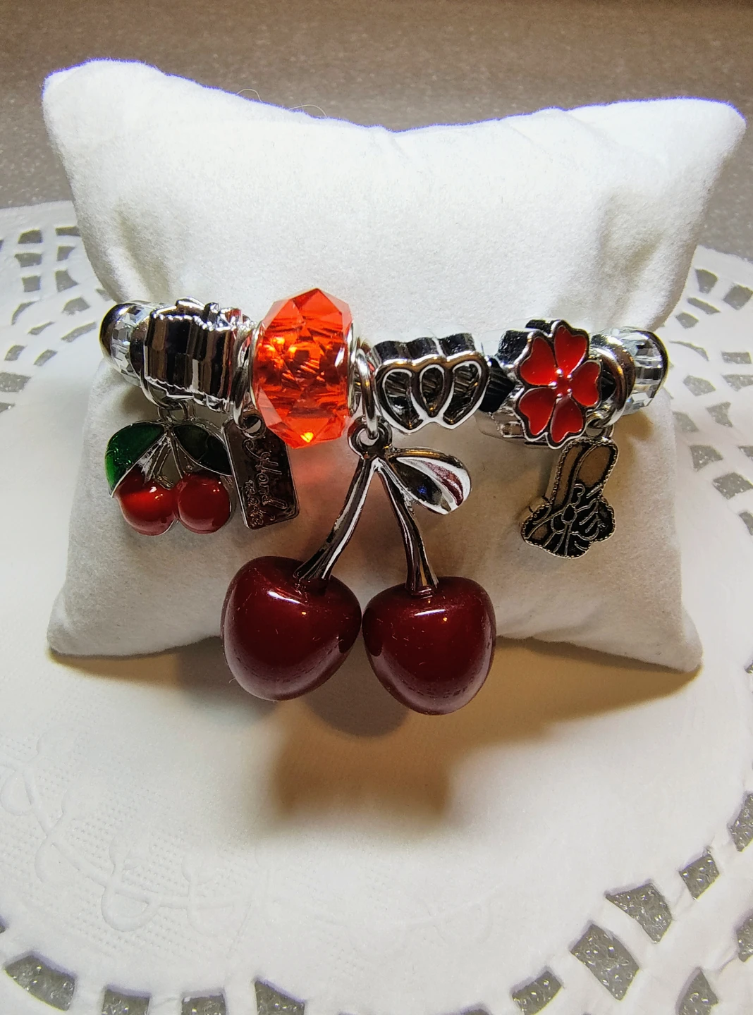 Charm Bracelet with a cherry and Flower Accents