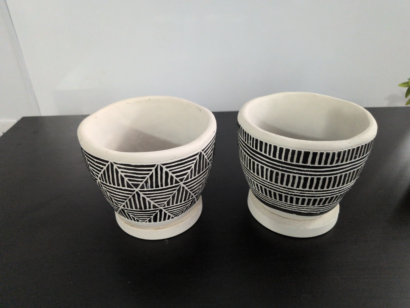 Set of two black and white patterned plant pots