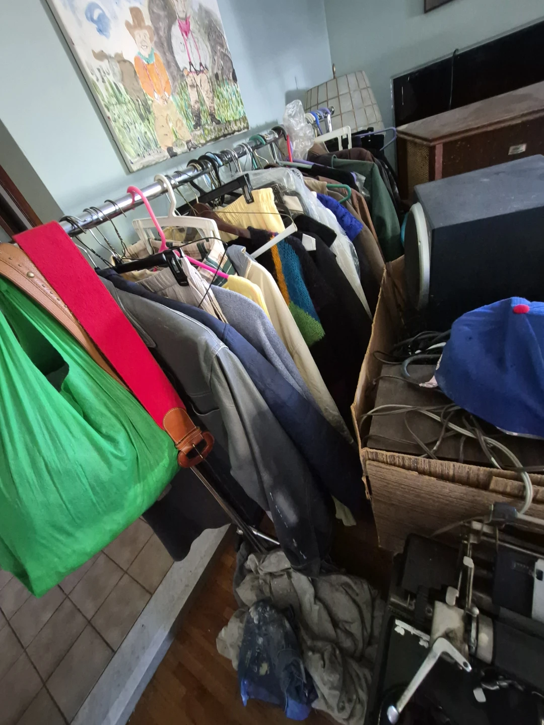 Lots of clothes, on a rack