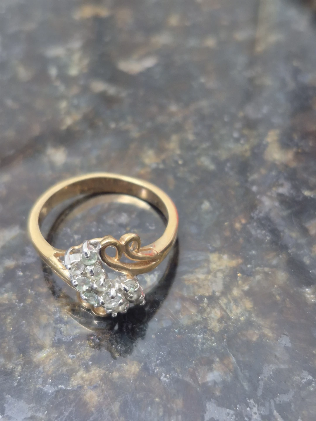 Gold-tone ring with clear stones