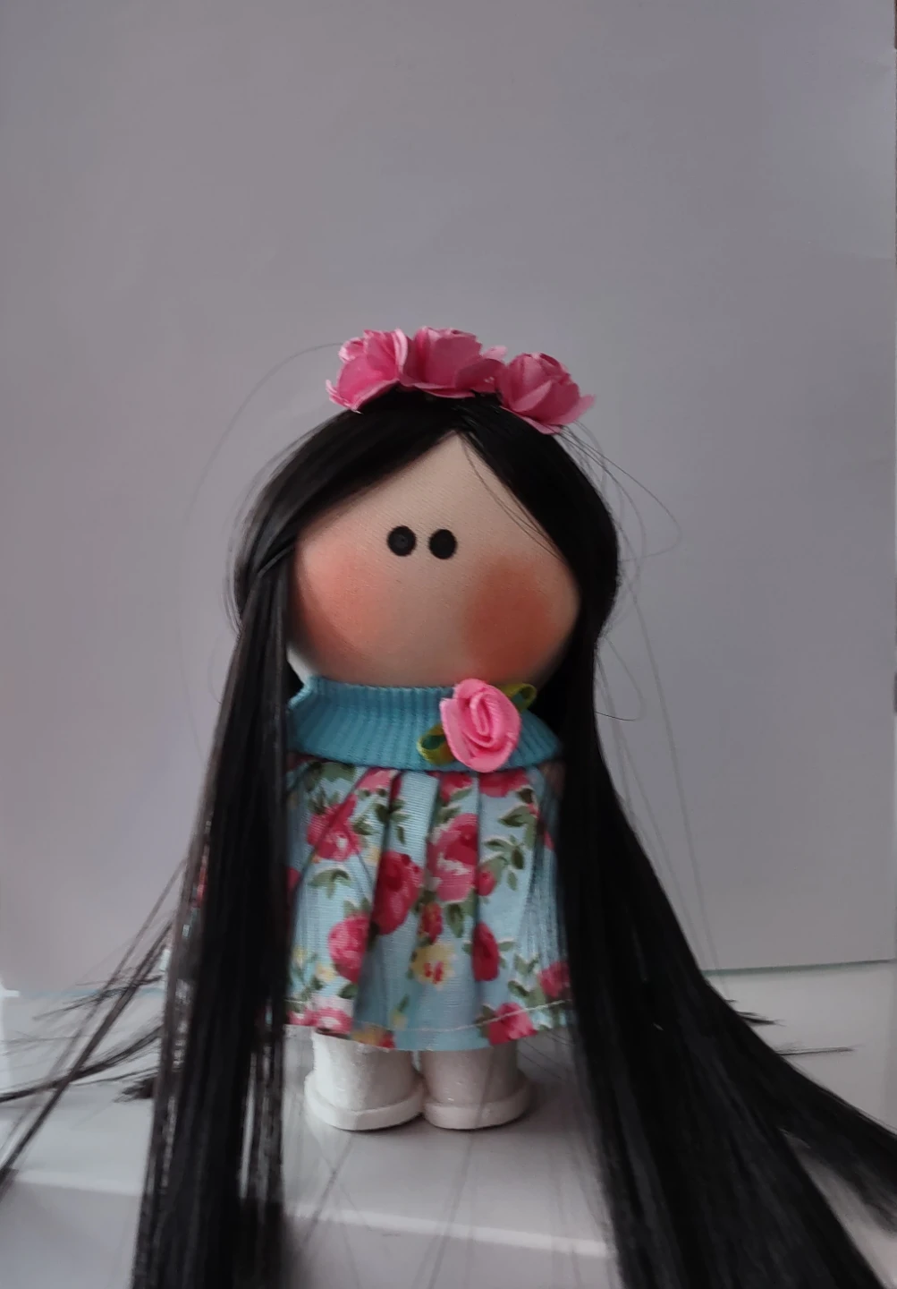 Handcrafted mini cloth doll with floral dress