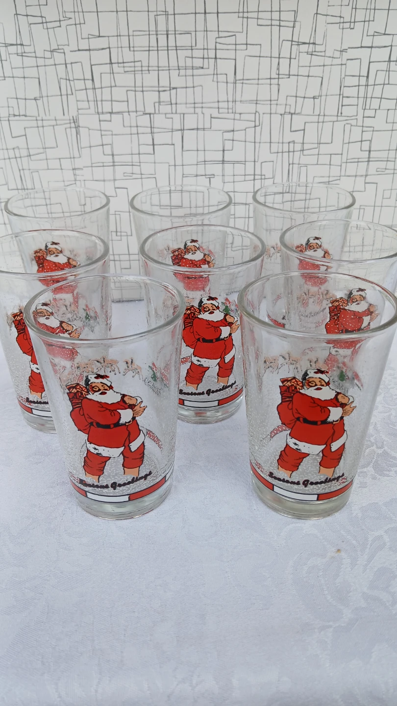 Collection of 8 Santa glasses for  $10.00