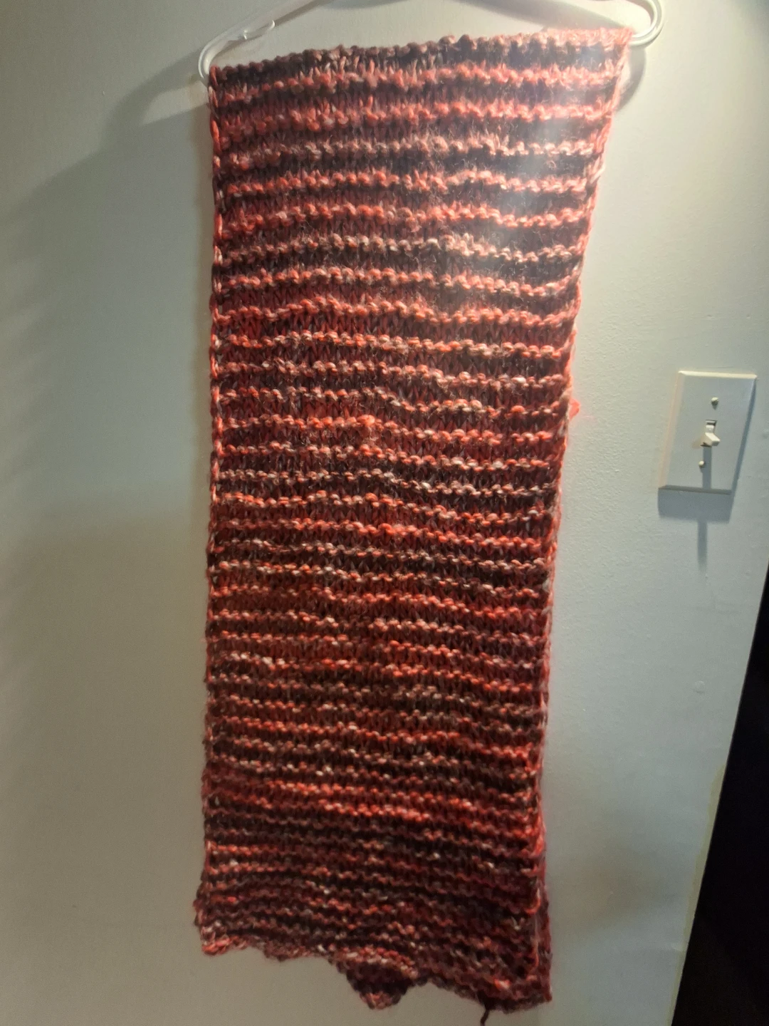 Hand-knitted pink and grey scarf