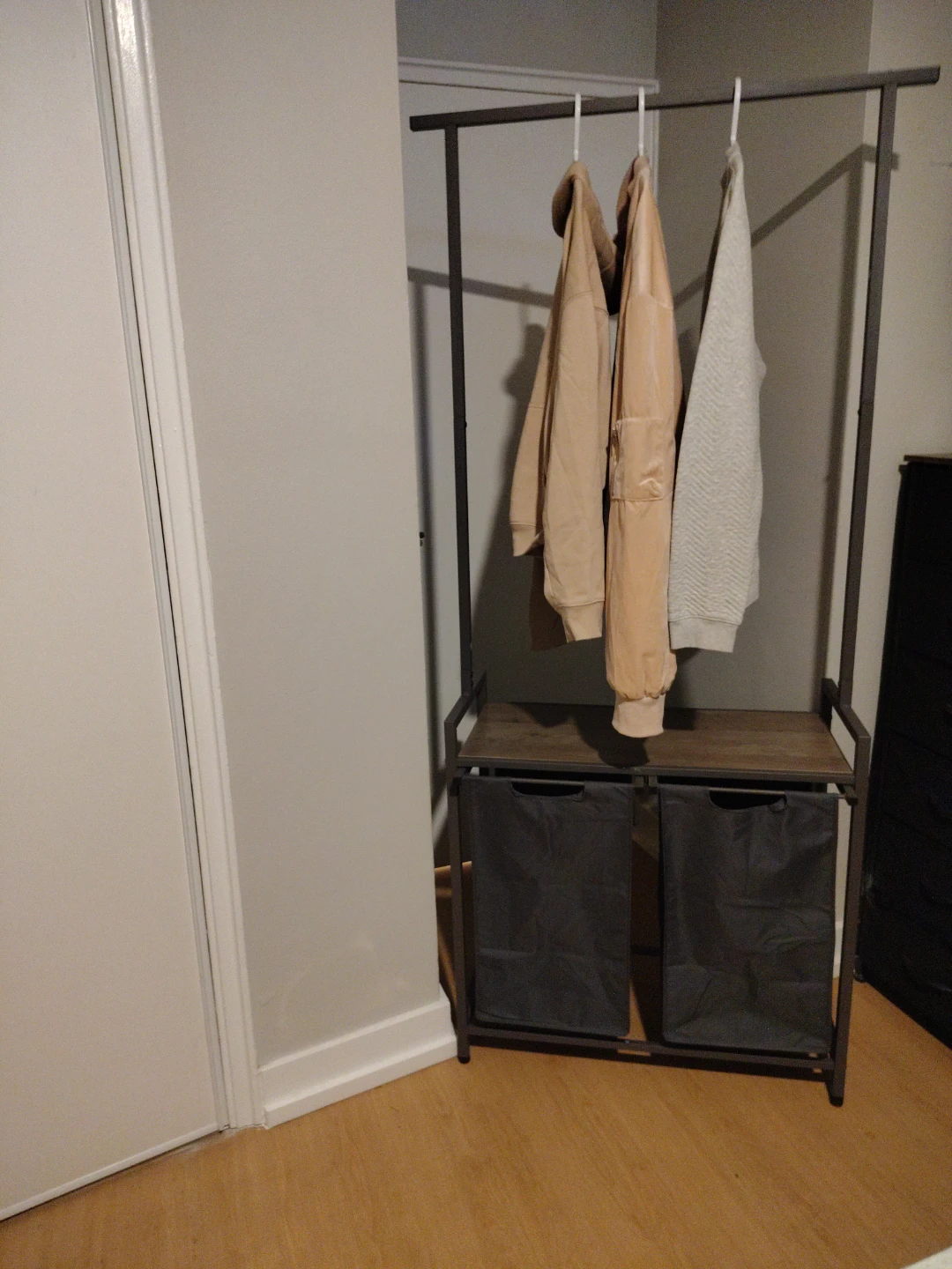 Clothing rack with dual laundry hampers - photo 3