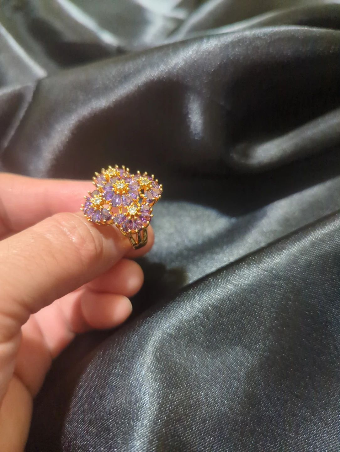 Gold-tone floral ring with purple stones