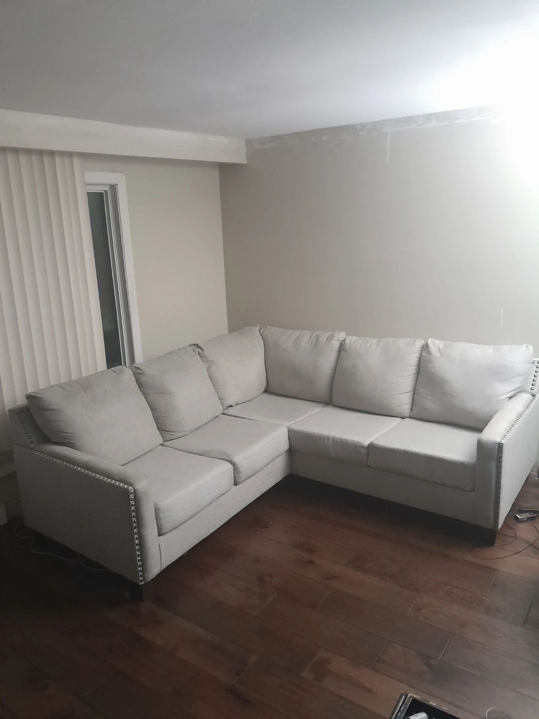 Light Grey Sectional Sofa with Nailhead Trim