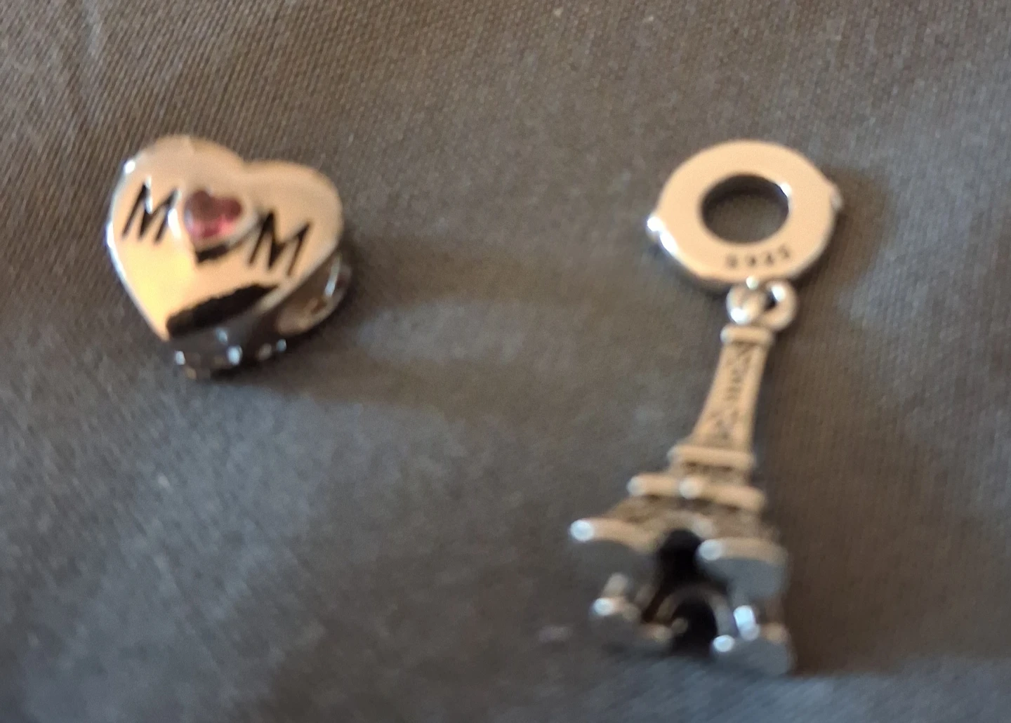 Two silver charms