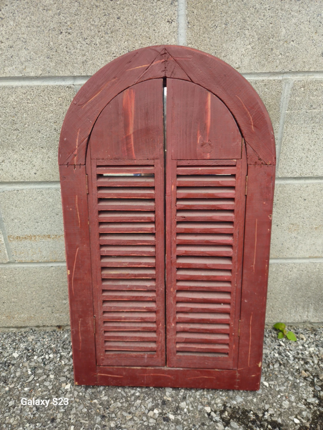Red arch wall mirror with shutters