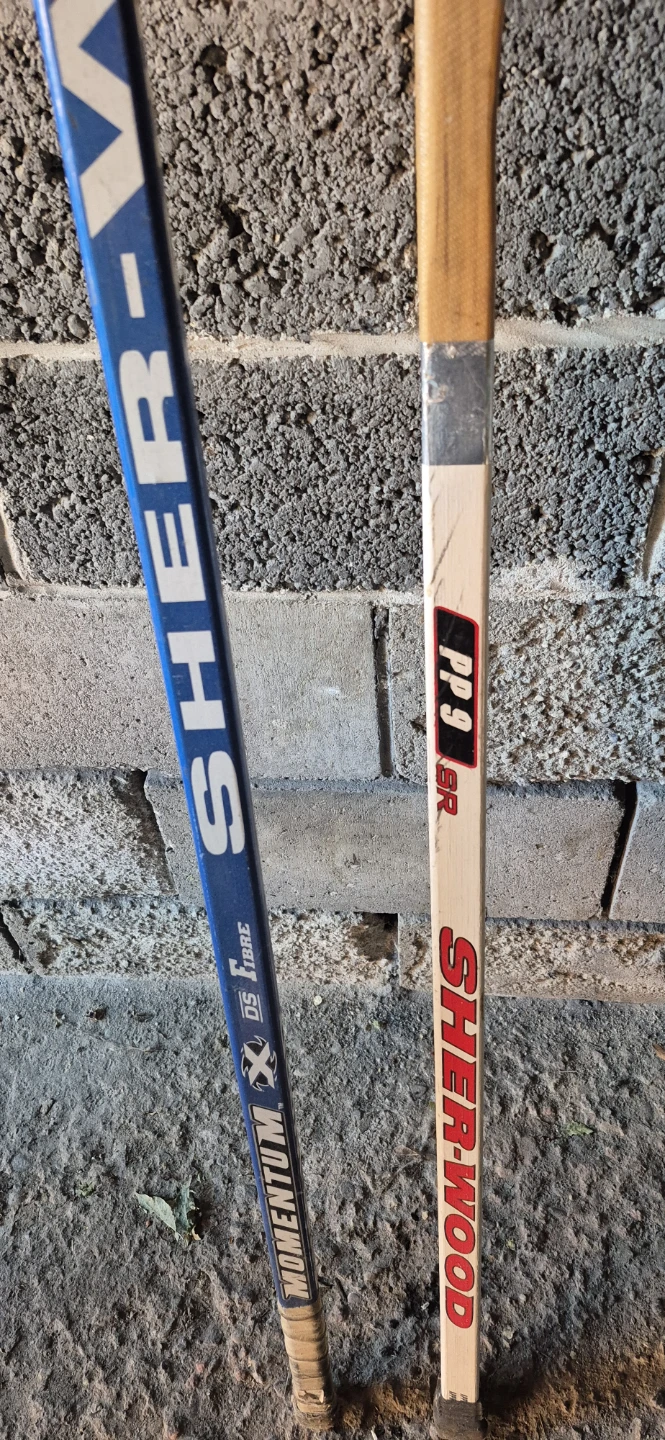 Two Sher-Wood Hockey Sticks