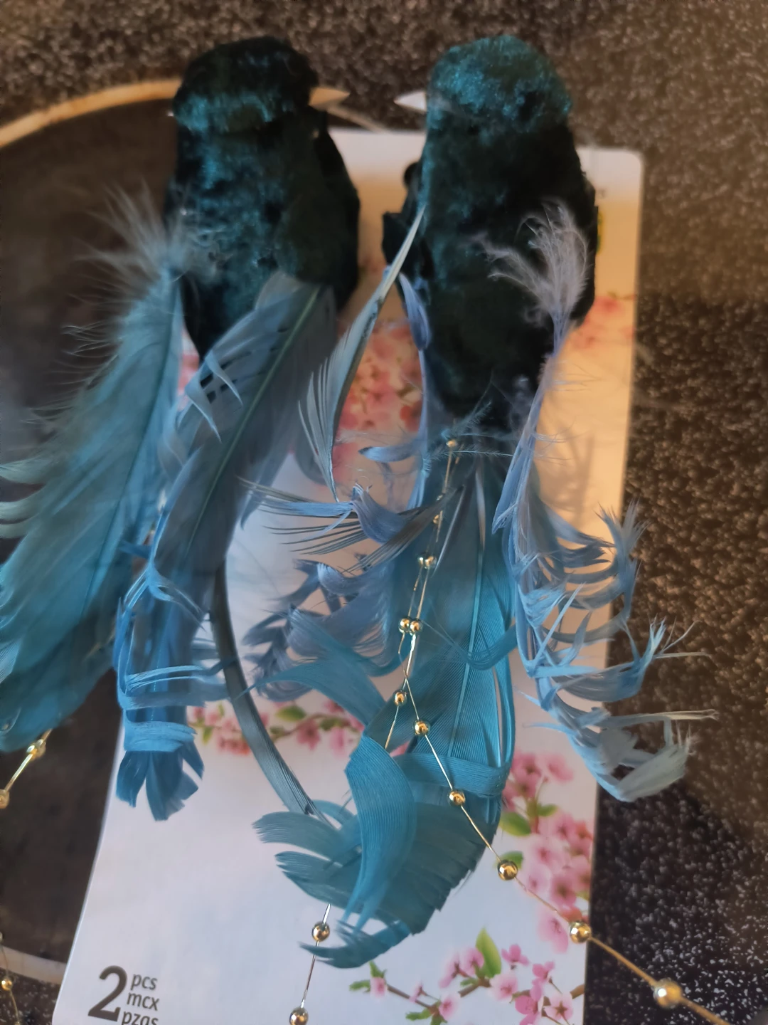 Two decorative bird ornaments