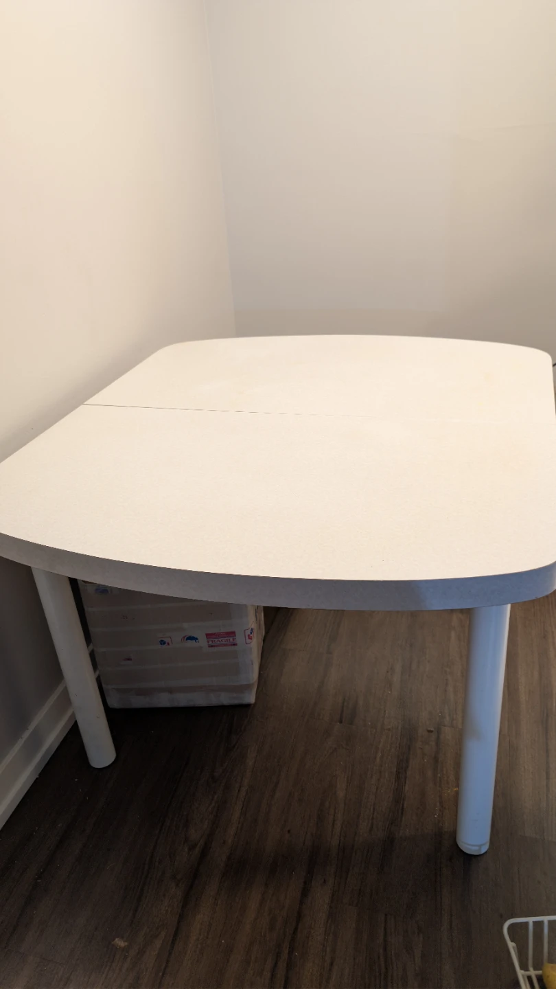 Expandable dining table with three chairs