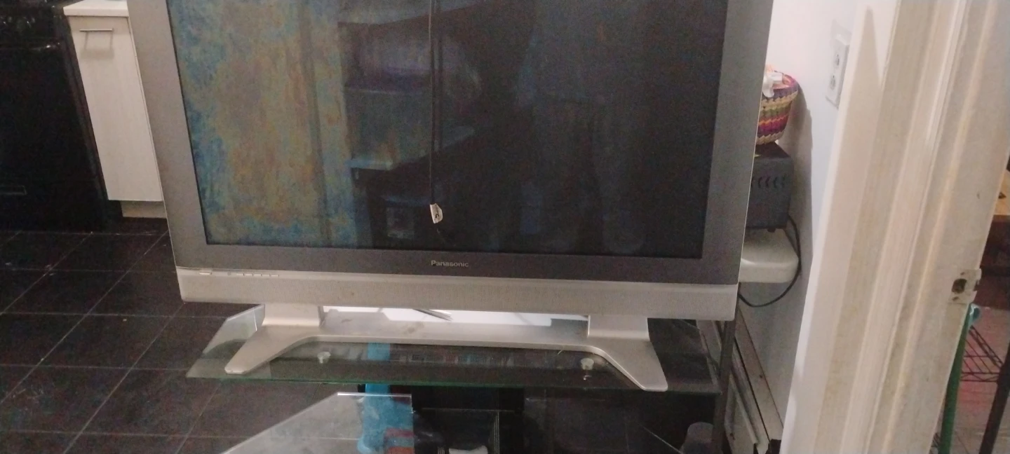 Old Panasonic tv with glass tv stand