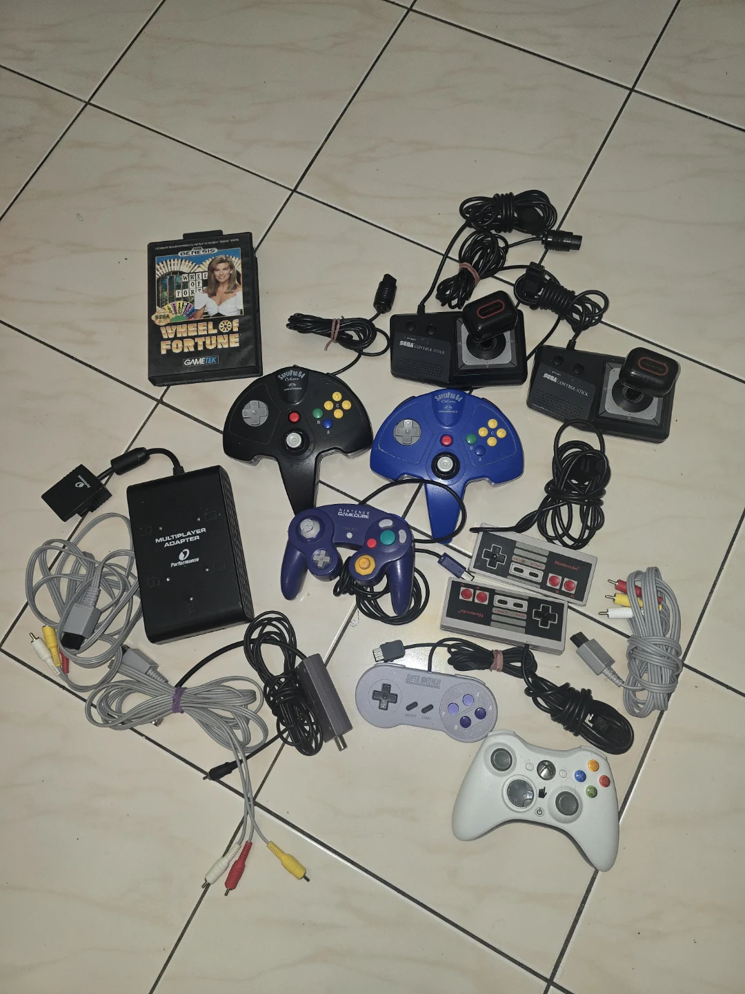 Assorted Retro Gaming Controllers and Accessories