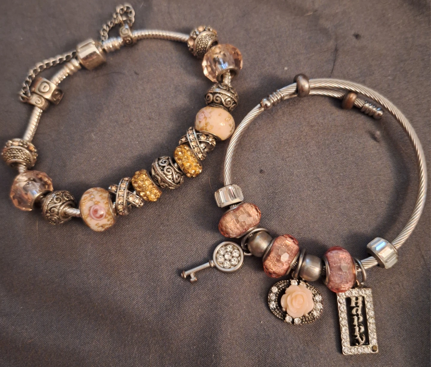 Two charm bracelets