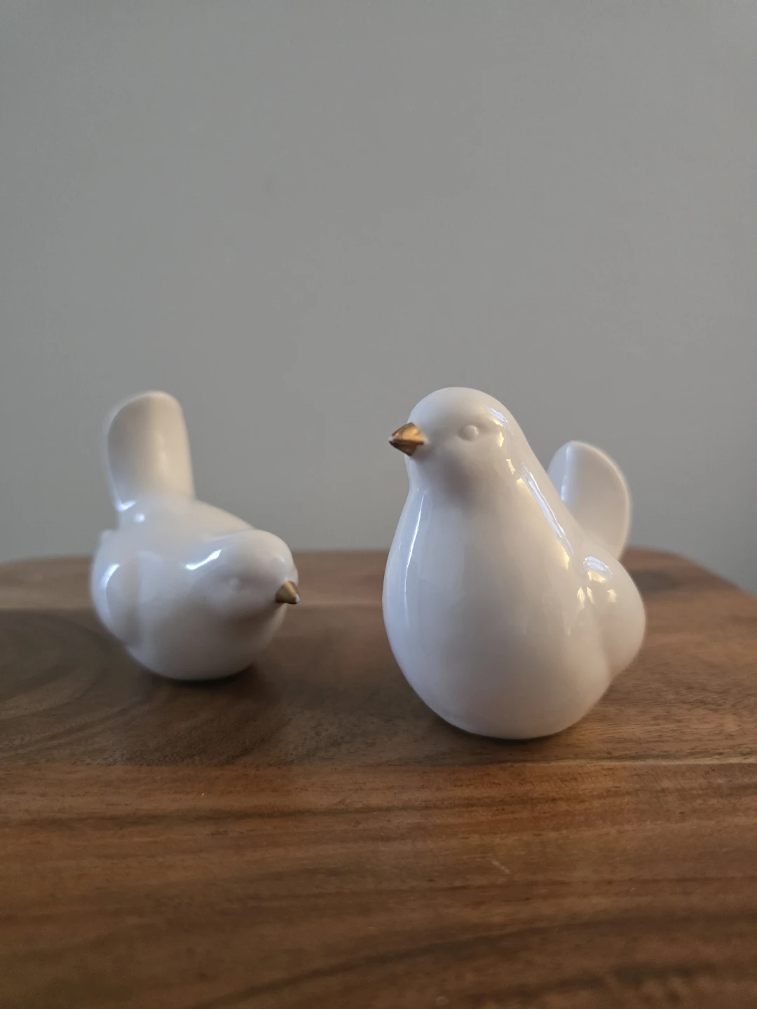 Set of two white ceramic bird figurines