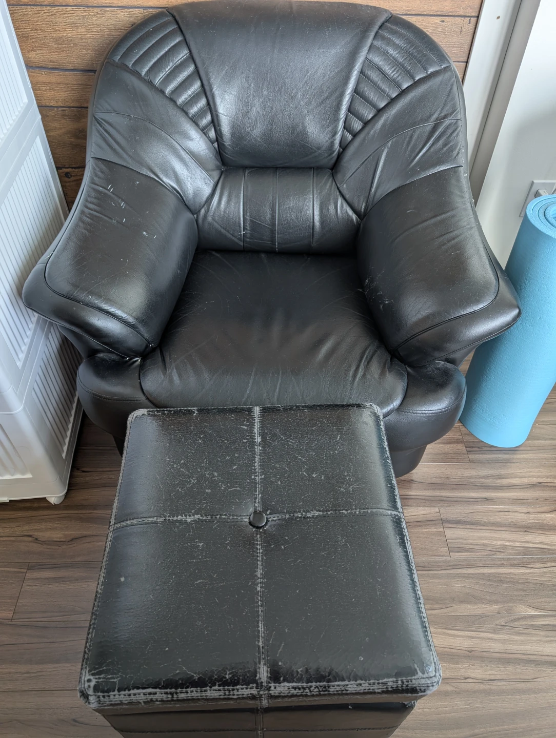 Black Leather Armchair and Ottoman