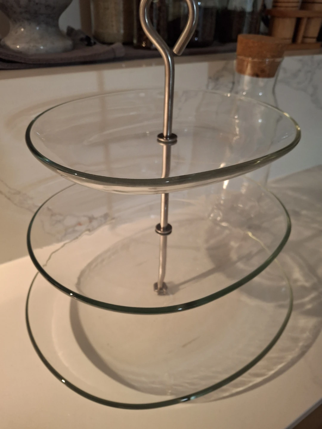 Glass Bottle and Three-Tiered Serving Stand