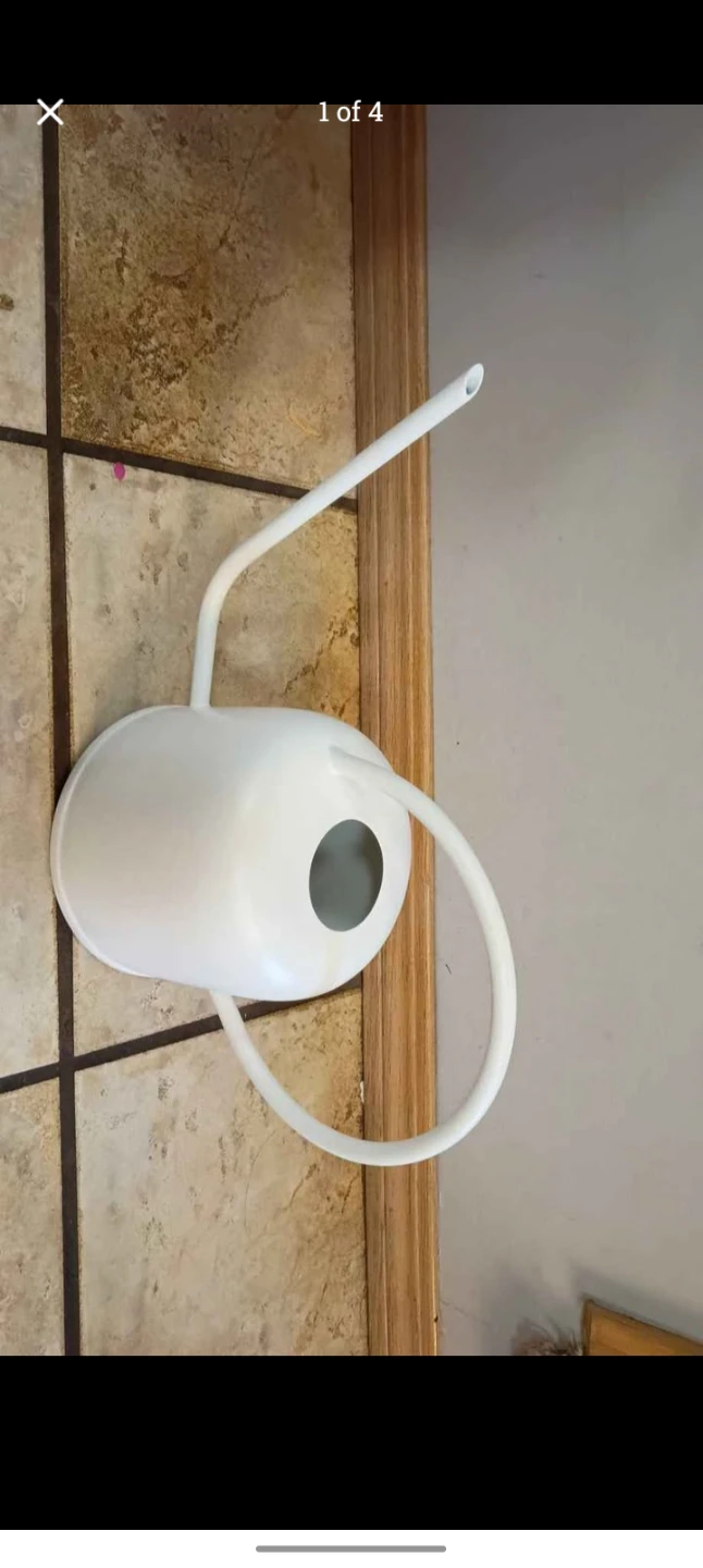 White metal watering can