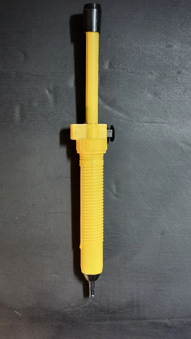 Yellow plastic soldering iron tool