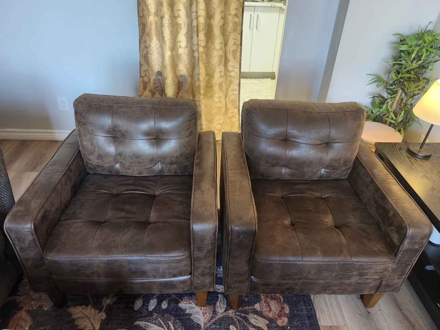 Set of two brown faux leather accent chairs