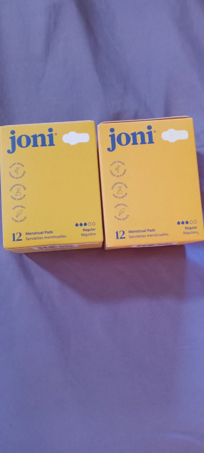 Two boxes of joni regular menstrual pads