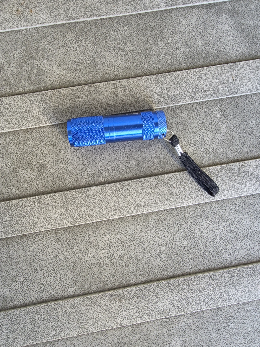 Blue compact flashlight