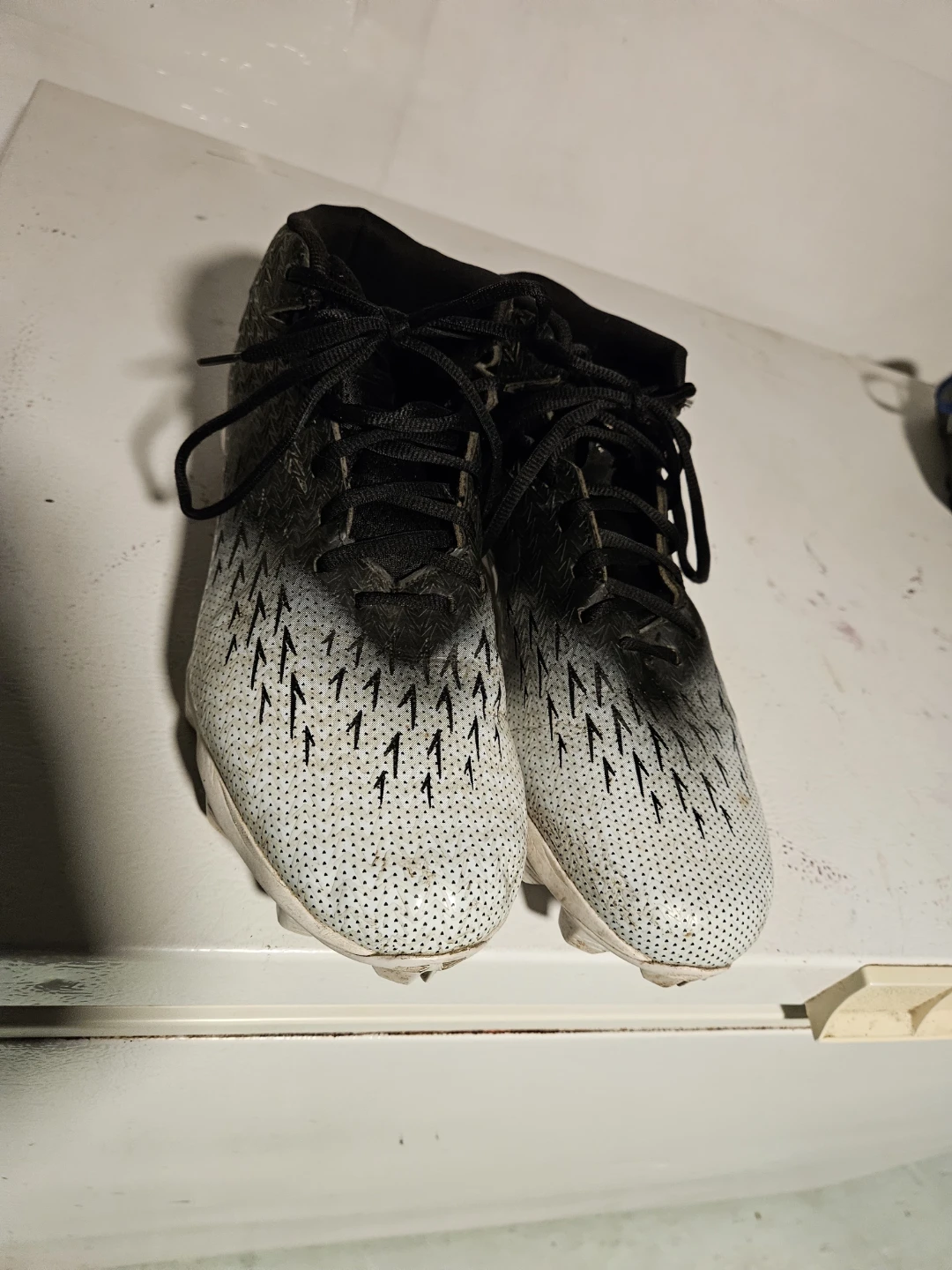 Three pairs of assorted athletic cleats - photo 3