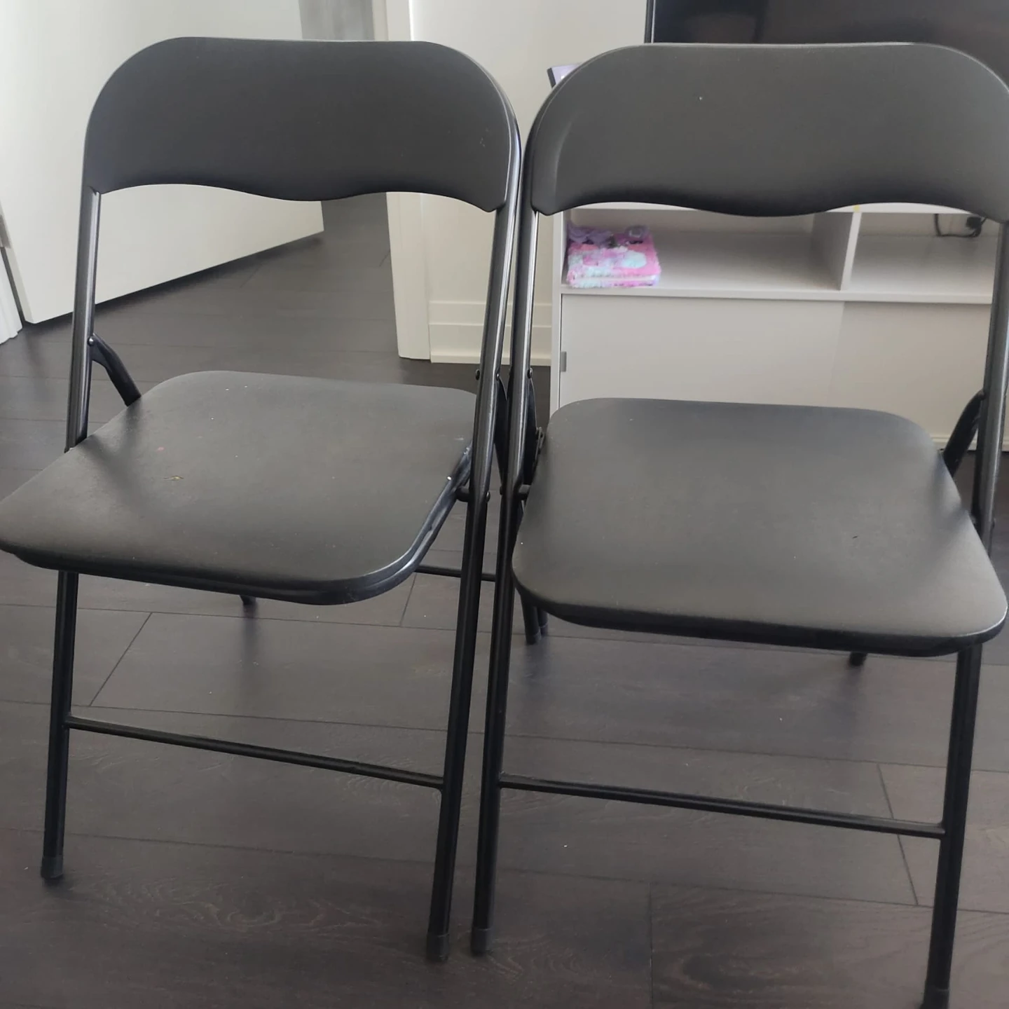 Two Black Metal Folding Chairs