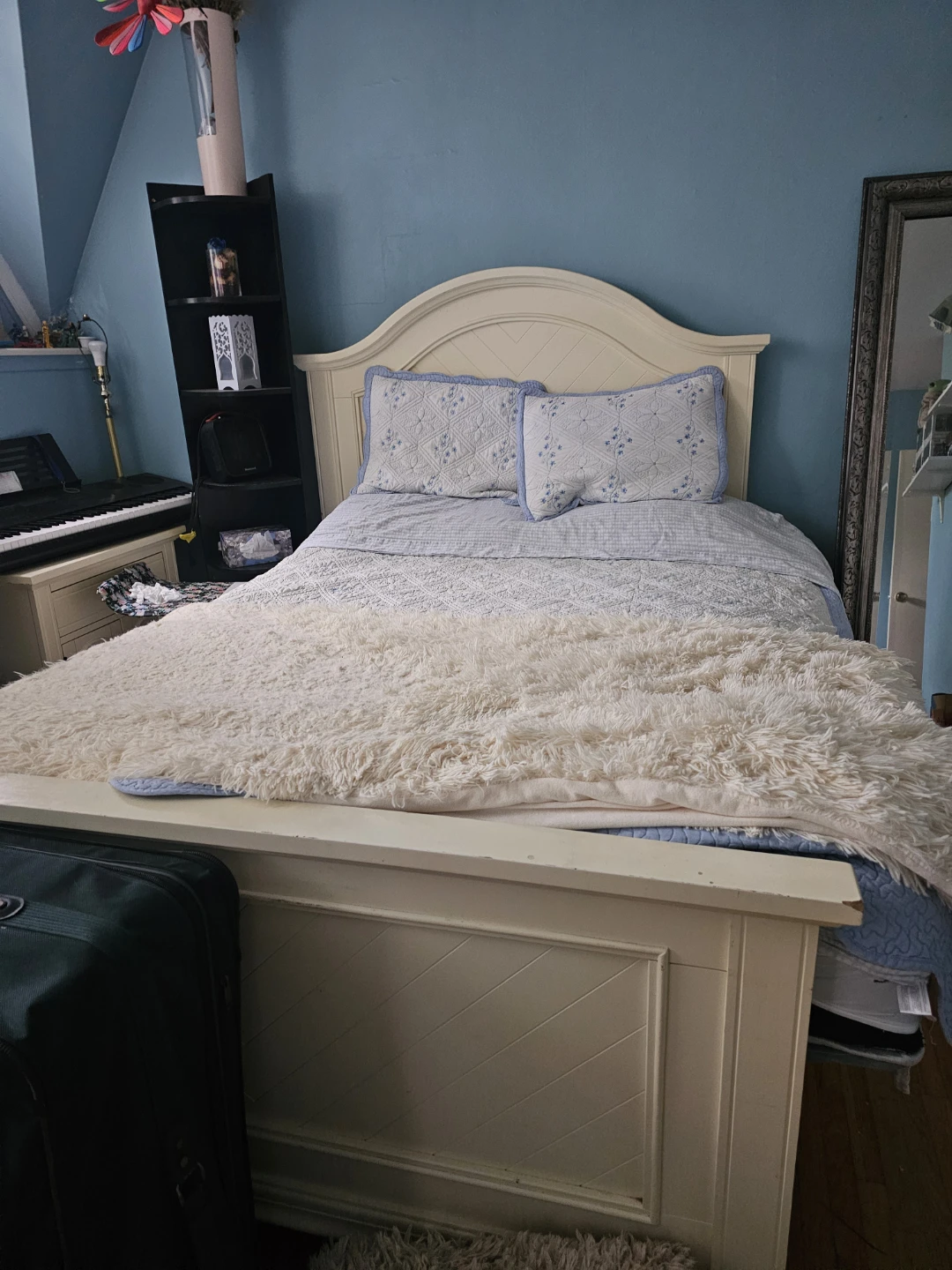 Cream-coloured wooden bed