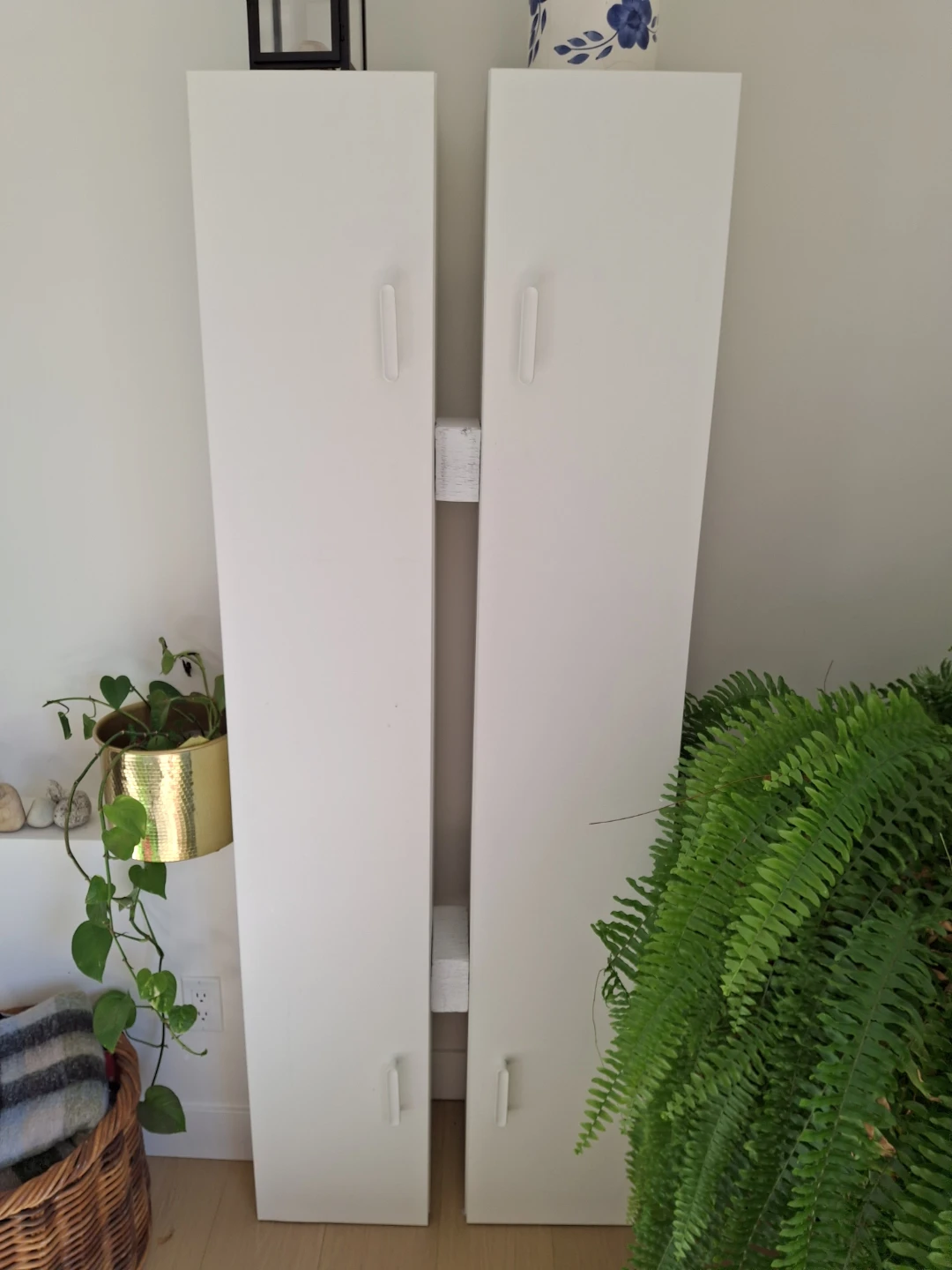 Set of two white narrow tall cabinets