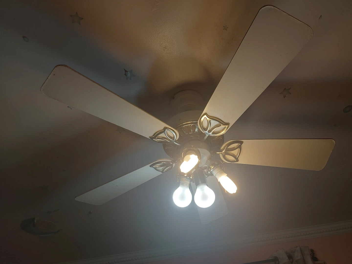 Five-blade white and brass ceiling fan with light fixture