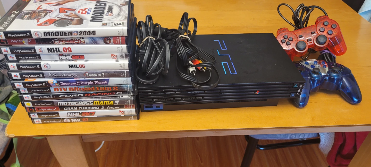 Sony PlayStation 2 Console with Controllers and Games